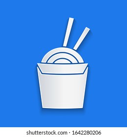 Paper cut Asian noodles in paper box and chopsticks icon isolated on blue background. Street fast food. Korean, Japanese, Chinese food. Paper art style. Vector Illustration