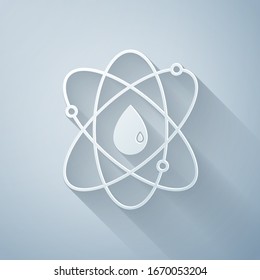 Paper cut Atom icon isolated on grey background. Symbol of science, education, nuclear physics, scientific research. Paper art style. Vector Illustration
