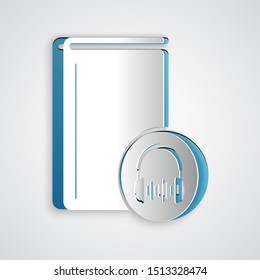 Paper cut Audio book icon isolated on grey background. Book with headphones. Audio guide sign. Online learning concept. Paper art style. Vector Illustration