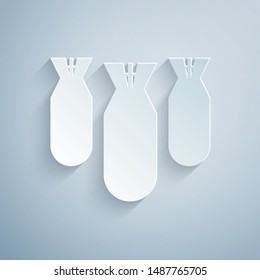 Paper cut Aviation bombs icon isolated on grey background. Rocket bomb flies down. Paper art style. Vector Illustration