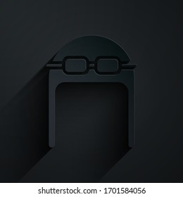 Paper cut Aviator hat with goggles icon isolated on black background. Pilot hat. Paper art style. Vector Illustration