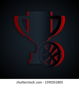 Paper cut Award cup with basketball ball icon isolated on black background. Winner trophy symbol. Championship or competition trophy. Paper art style. Vector Illustration