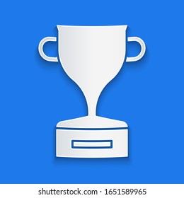 Paper cut Award cup icon isolated on blue background. Winner trophy symbol. Championship or competition trophy. Sports achievement sign. Paper art style. Vector Illustration