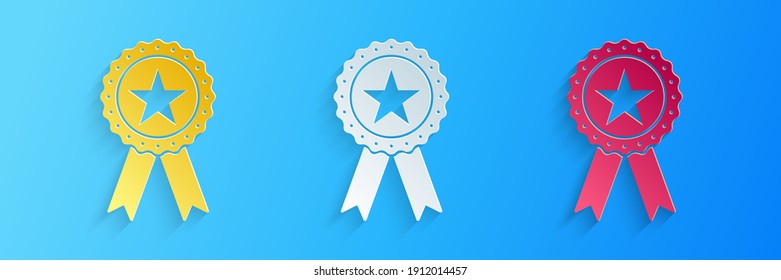 Paper cut Award medal with star and ribbon icon isolated on blue background. Winner achievement sign. Champion medal emblem. Success symbol. Paper art style. Vector.