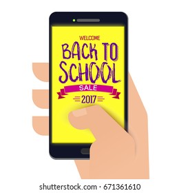 Paper cut Back to school banner on smartphone with paper hand. Back to school logo. Vector illustration. Hand drawn lettering. Typography tag. Retro styled