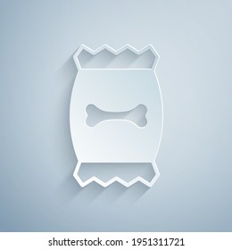Paper cut Bag of food for pet icon isolated on grey background. Food for animals. Dog bone sign. Pet food package. Paper art style. Vector