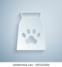 Paper cut Bag of food for pet icon isolated on grey background. Food for animals. Dog bone sign. Pet food package. Paper art style. Vector