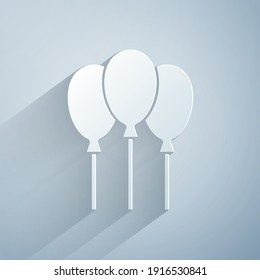 Paper cut Balloons with ribbon icon isolated on grey background. Paper art style. Vector