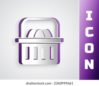 Paper cut Basket with easter eggs icon isolated on grey background. Happy Easter. Paper art style. Vector Illustration