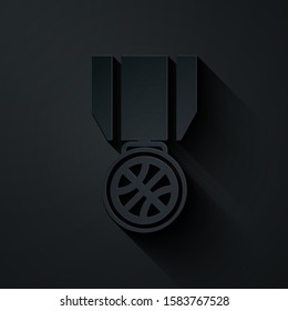 Paper cut Basketball medal with ribbon icon isolated on black background. Paper art style. Vector Illustration