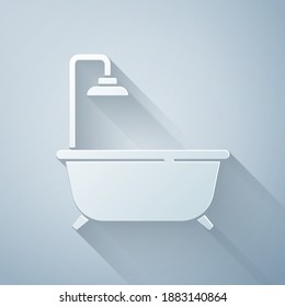 Paper cut Bathtub with shower icon isolated on grey background. Paper art style. Vector