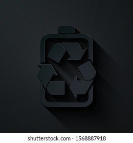 Paper cut Battery with recycle symbol line icon isolated on black background. Battery with recycling symbol - renewable energy concept. Paper art style. Vector Illustration