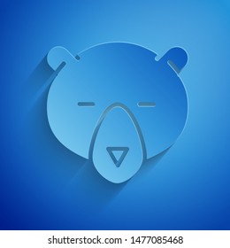 Paper cut Bear head icon isolated on blue background. Paper art style. Vector Illustration