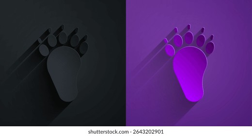 Paper cut Bear paw footprint icon isolated on black on purple background. Paper art style. Vector