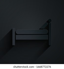 Paper cut Bed icon isolated on black background. Paper art style. Vector Illustration