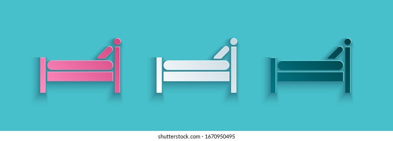 Paper cut Bed icon isolated on blue background. Paper art style. Vector Illustration