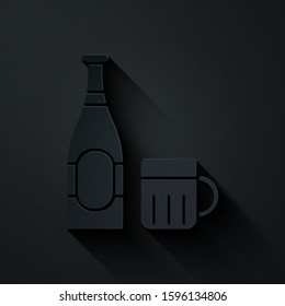 Paper cut Beer bottle and glass icon isolated on black background. Alcohol Drink symbol. Paper art style. Vector Illustration