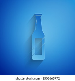 Paper cut Beer bottle icon isolated on blue background. Paper art style. Vector Illustration