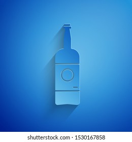 Paper cut Beer bottle icon isolated on blue background. Paper art style. Vector Illustration