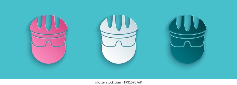 Paper cut Bicycle helmet icon isolated on blue background. Extreme sport. Sport equipment. Paper art style. Vector