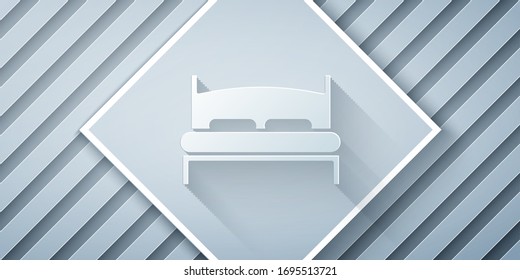 Paper cut Big bed for two or one person icon isolated on grey background. Paper art style. Vector Illustration