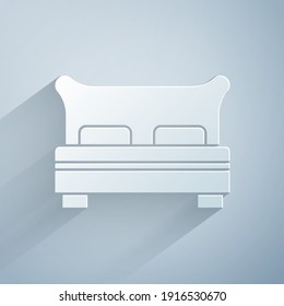 Paper cut Big bed for two or one person icon isolated on grey background. Paper art style. Vector