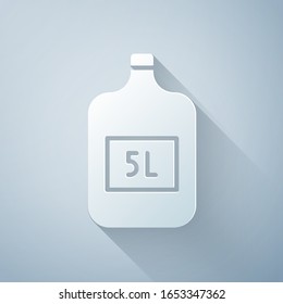 Paper cut Big bottle with clean water icon isolated on grey background. Plastic container for the cooler. Paper art style. Vector Illustration