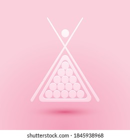 Paper cut Billiard cue and balls in a rack triangle icon isolated on pink background. Paper art style. Vector.