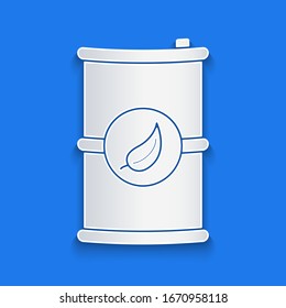 Paper cut Bio fuel barrel icon isolated on blue background. Eco bio and canister. Green environment and recycle. Paper art style. Vector Illustration