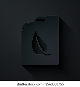 Paper cut Bio fuel canister icon isolated on black background. Eco bio and barrel. Green environment and recycle. Paper art style. Vector Illustration