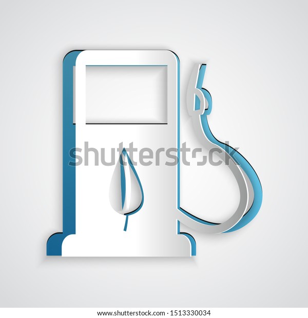 Paper cut Bio fuel concept\
with fueling nozzle and leaf icon isolated on grey background. Gas\
station with leaves. Eco refueling. Paper art style. Vector\
Illustration