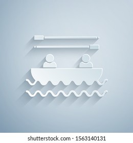 Paper cut Boat with oars and people icon isolated on grey background. Water sports, extreme sports, holiday, vacation, team building. Paper art style. Vector Illustration