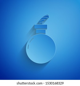 Paper cut Bomb ready to explode icon isolated on blue background. Happy Halloween party. Paper art style. Vector Illustration