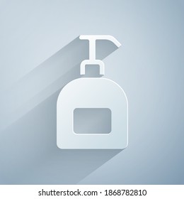 Paper cut Bottle of liquid antibacterial soap with dispenser icon isolated on grey background. Antiseptic. Disinfection, hygiene, skin care. Paper art style. Vector