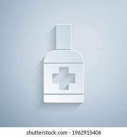 Paper cut Bottle of liquid antibacterial soap with dispenser icon isolated on grey background. Antiseptic. Disinfection, hygiene, skin care. Paper art style. Vector