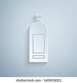 Paper cut Bottle of shampoo icon isolated on grey background. Paper art style. Vector Illustration