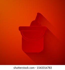 Paper cut Bottle of wine in an ice bucket icon isolated on red background. Paper art style. Vector Illustration