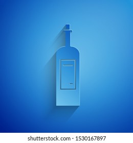 Paper cut Bottle of wine icon isolated on blue background. Paper art style. Vector Illustration