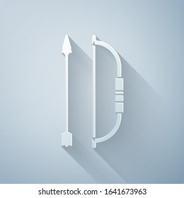 Paper cut Bow and arrow in quiver icon isolated on grey background. Paper art style. Vector Illustration