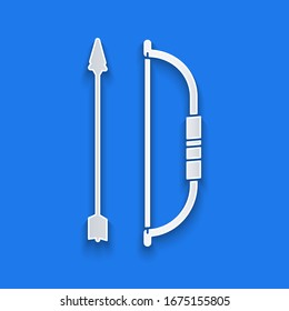 Paper cut Bow and arrow in quiver icon isolated on blue background. Paper art style. Vector Illustration