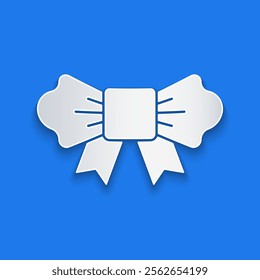 Paper cut Bow tie icon isolated on blue background. Paper art style. Vector