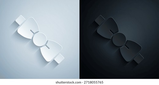 Paper cut Bow tie icon isolated on grey and black background. Paper art style. Vector