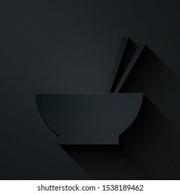 Paper cut Bowl with asian food and pair of chopsticks silhouette icon isolated on black background. Concept of prepare, eastern diet. Paper art style. Vector Illustration