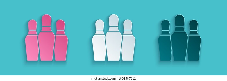 Paper cut Bowling pin icon isolated on blue background. Paper art style. Vector