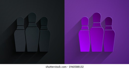 Paper cut Bowling pin icon isolated on black on purple background. Paper art style. Vector