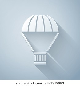 Paper cut Box flying on parachute icon isolated on grey background. Parcel with parachute for shipping. Delivery service, air shipping. Paper art style. Vector Illustration