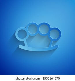 Paper cut Brass knuckles icon isolated on blue background. Paper art style. Vector Illustration