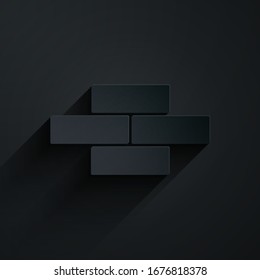 Icono de ladrillos cortados en papel aislado en fondo negro. Estilo de arte de papel.  Ilustración vectorial