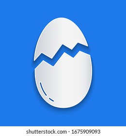 Paper cut Broken egg icon isolated on blue background. Happy Easter. Paper art style. Vector Illustration