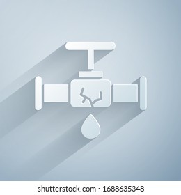 Paper cut Broken metal pipe with leaking water icon isolated on grey background. Paper art style. Vector Illustration